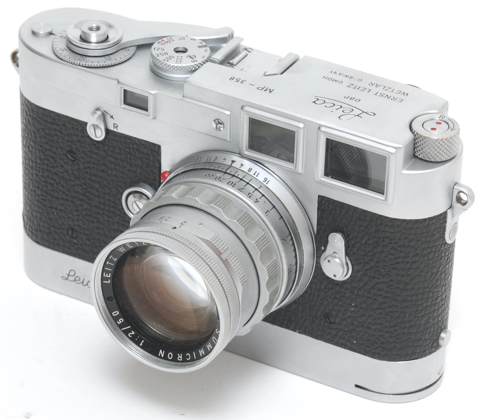 Chrome Leica MP rangefinder with a 50mm Summicron lens, three-quarter view on white