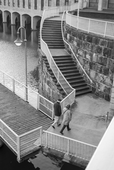 A couple walking next to the river
